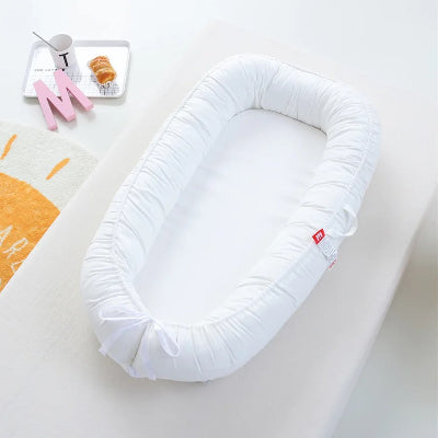 reducteur de lit blanc